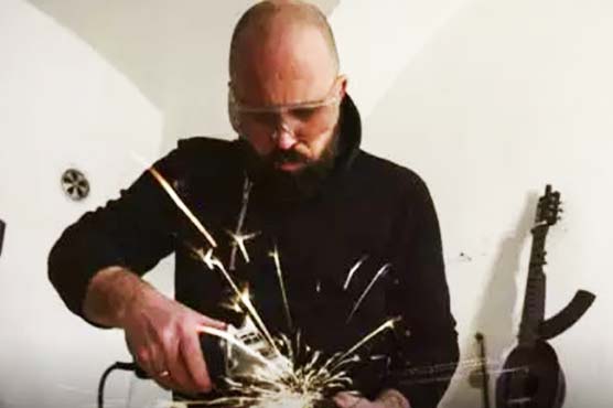 Changing the tune: Serbian artist turns weapons into instruments