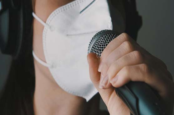 Singing opera in a surgical mask