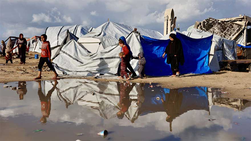 'Shivering from cold and fear': winter rains batter displaced Gazans