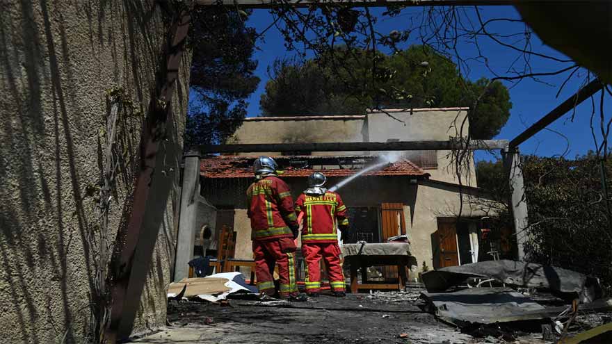 France battles smouldering fire near Marseille, warns of flare-ups