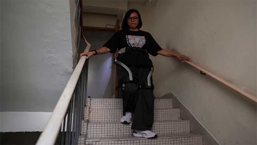 Robotic legs help elderly Hong Kong fire survivors climb back for belongings