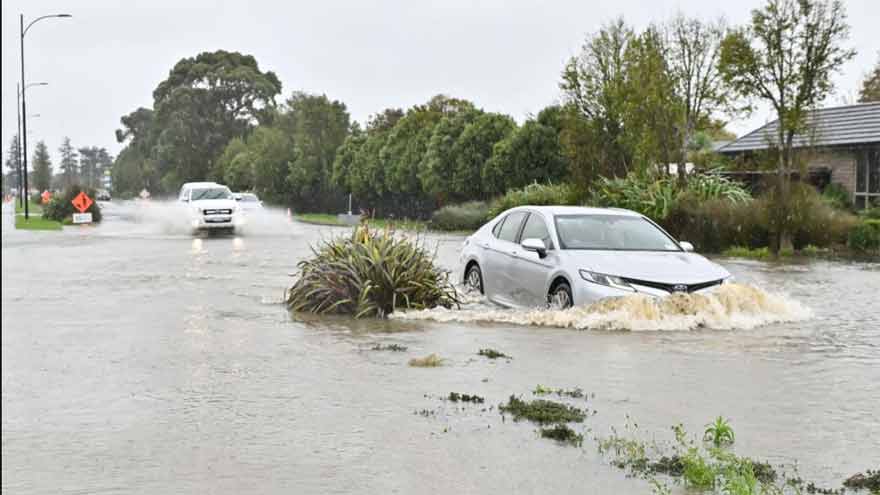 New Zealand braces for more flooding after road collapses, one death