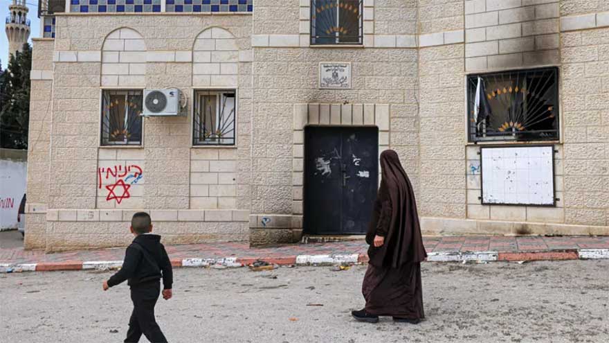 Israeli settlers burn buildings in attacks on West Bank villages